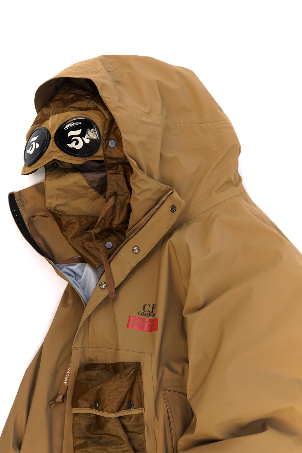 C.P. COMPANY - GORE-TEX 3L INFINIUM MIXED GOGGLE DOWN PARKA - CUMIN